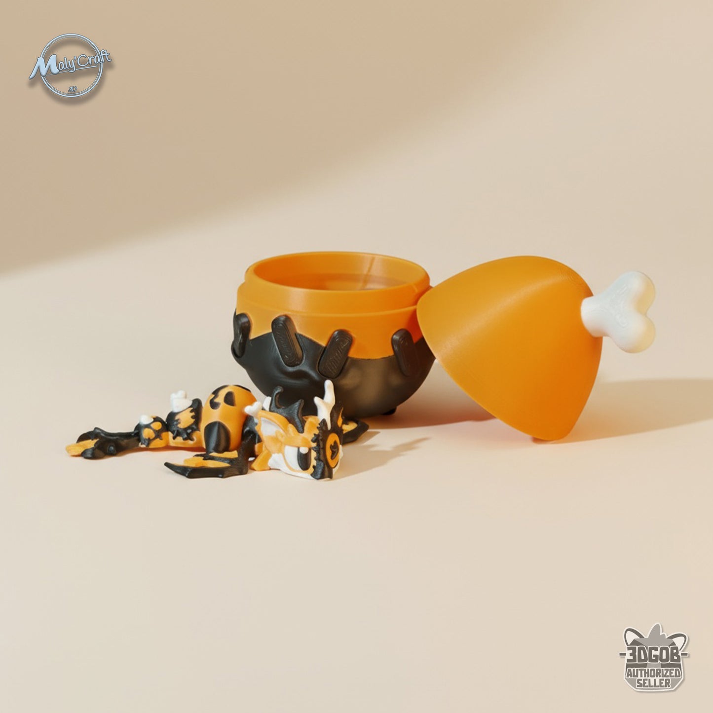 Figurine dragon articulé Halloween orange et noir sortant de son œuf surprise, impression 3D en PLA Made in France.