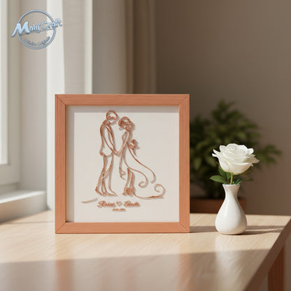 Cadre mariage terracotta sur tissu blanc, mis en scène sur un meuble. Lumière naturelle et ambiance chaleureuse, création Maly’Craft en impression 3D made in France.