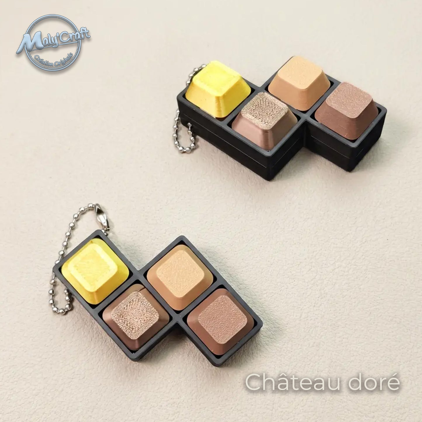 Clicker de clavier portable modèle Château doré, finition soie or et noir. Expertise technique en impression 3D avec filaments eSun et Panchroma pour un aspect brillant. Fabriqué en France en acide polylactique de précision. Design élégant et ergonomique