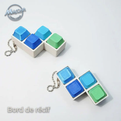 Porte-clé clicker Bord de récif, dégradé de bleus et blancs inspiré de l'océan. Impression 3D de précision en France, filaments mat eSun. Structure solide en acide polylactique. Format compact idéal pour un usage quotidien